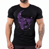 A man wearing a black short-sleeve t-shirt with a purple rhinestone skull by Rico Starr