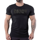 Black t-shirt with black rhinestone “Daddy” text, gay men’s clubwear by Rico Starr