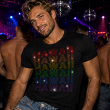 A man in a nightclub wearing a black t-shirt with 'HAWAII' printed repeatedly in a rainbow rhinestones by Rico Starr