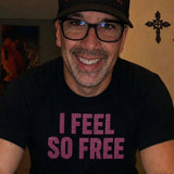 Man wearing a black “I Feel So Free” pink rhinestone t-shirt by Rico Starr