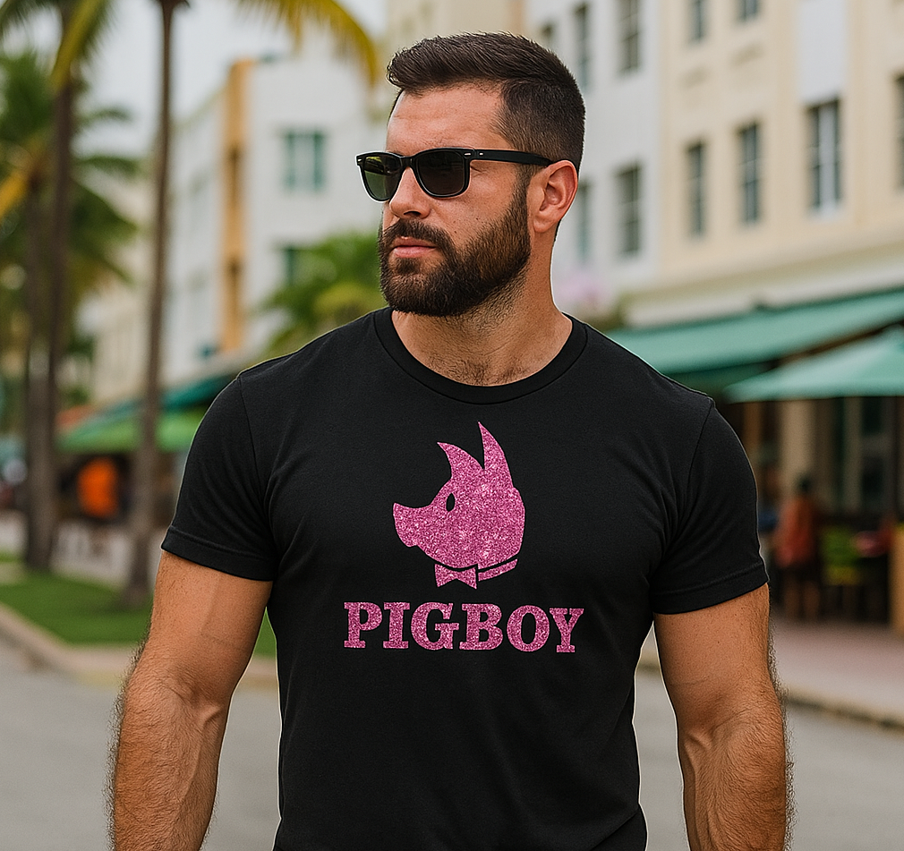Man wearing a black t-shirt with 'Pigboy' graphic and sunglasses outdoors.