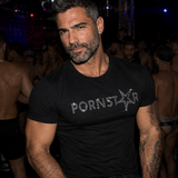 Black fitted men’s t-shirt with sparkling rhinestone Pornstar graphic, edgy gay nightlife fashion by Rico Starr