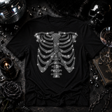 Black t-shirt with rhinestone skeleton ribcage and spine graphic covering the torso by Rico Starr