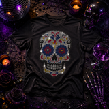 A black short-sleeve t-shirt with a large, colorful rhinestone sugar skull graphic on the front by Rico Starr