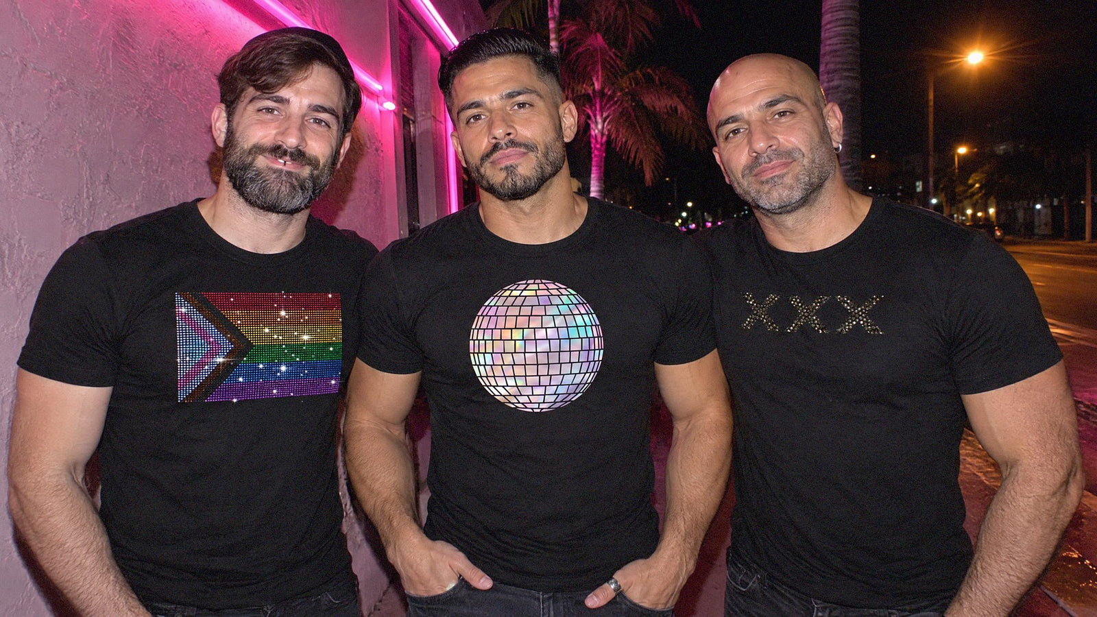 Three friends in Rico Starr rhinestone and foil shirts outside a Miami gay bar at night