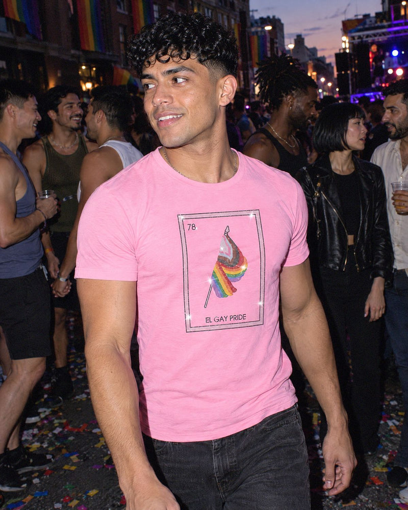 A man at a party wearing the El Gay Pride shirt