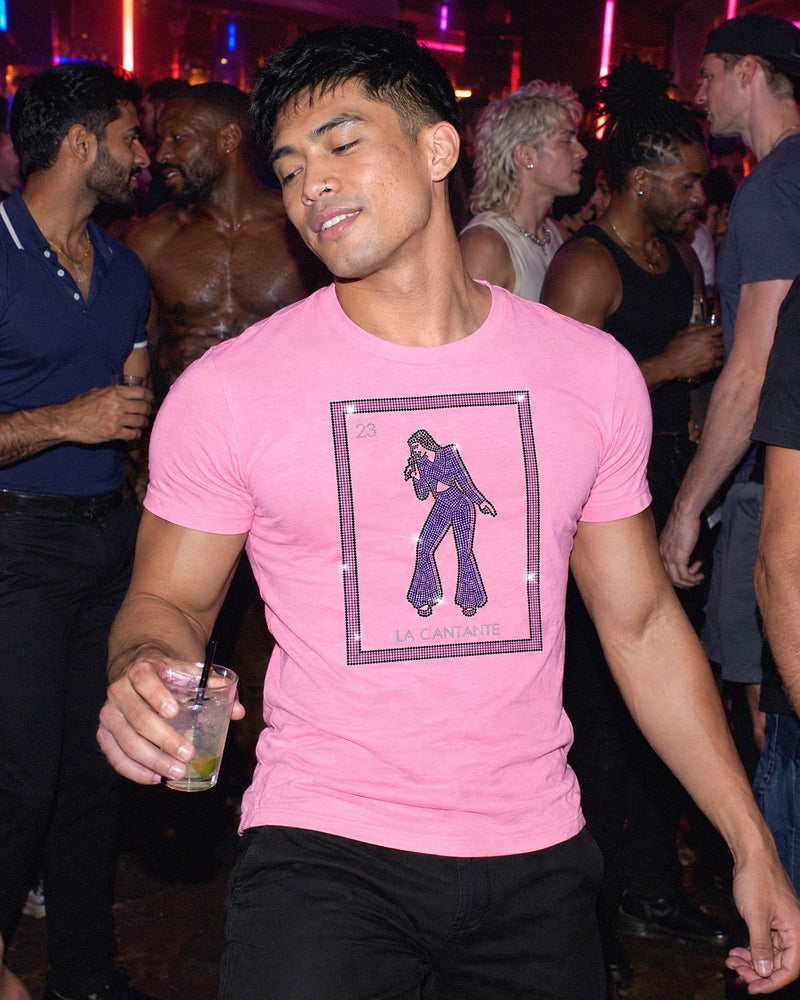 A man at a party wearing the La Cantante shirt